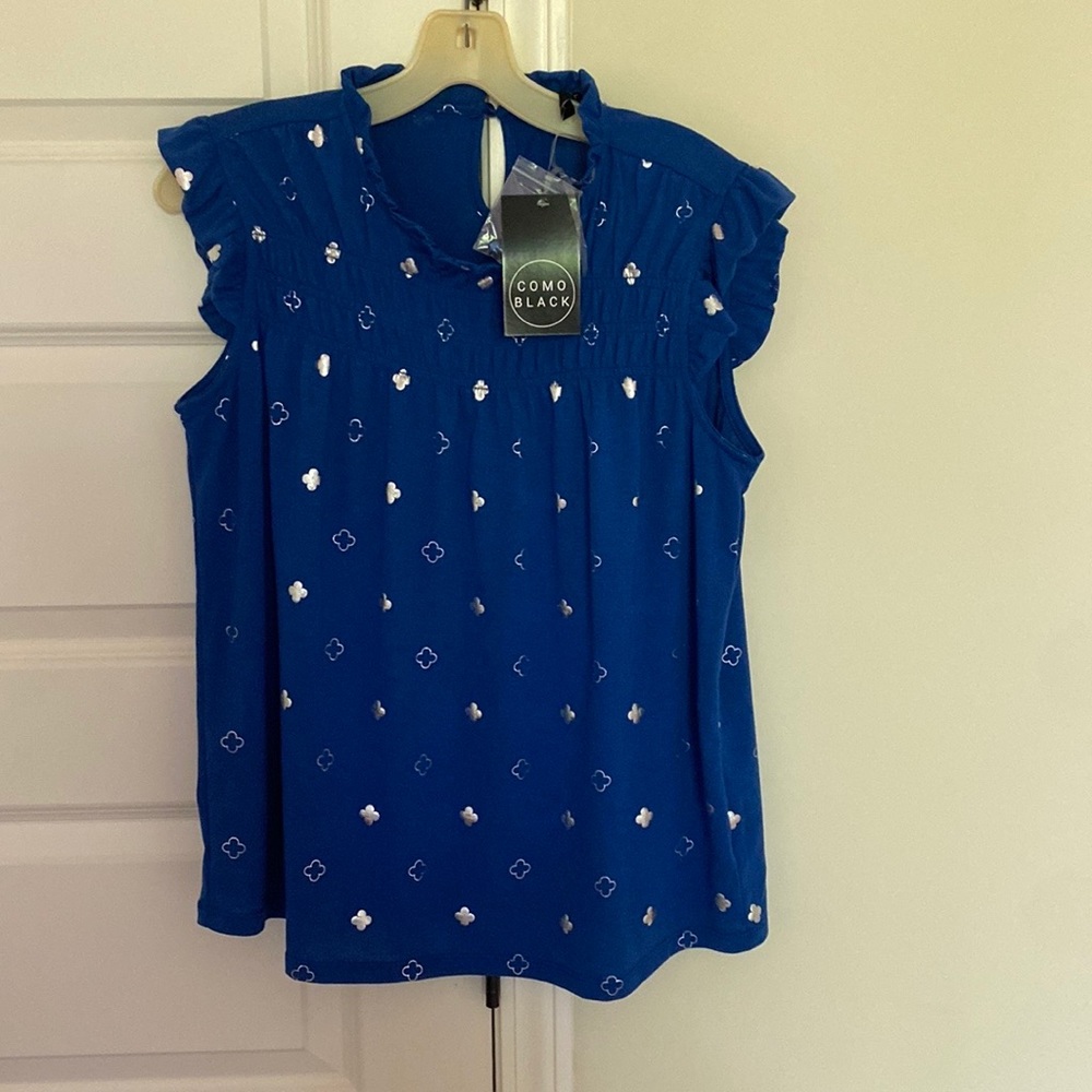 Shimmer and shine in Mediterranean blue top with silver clover